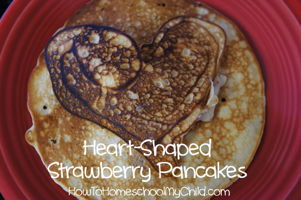 valentines day recipes -heart-shaped strawberry pancakes, with coconut, pecans & white chocolate chips from HowToHomeschoolMyChild.com